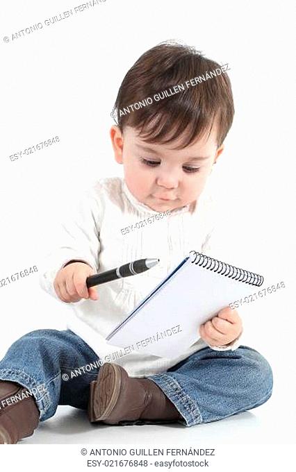 Baby with a notebook and a pen