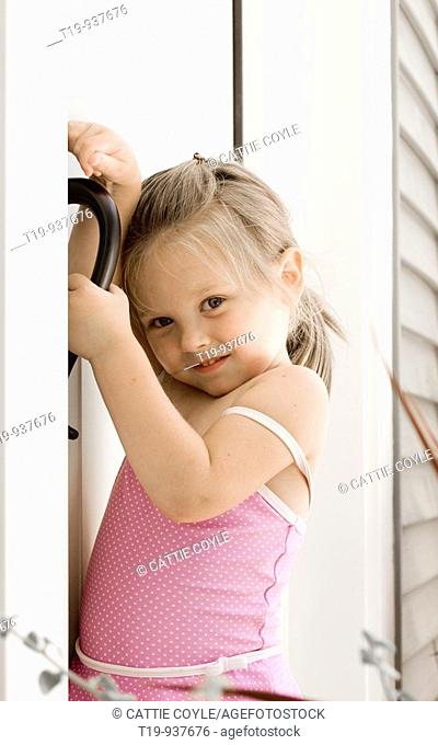 4-year old girl at the front door of her home  MR