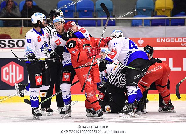 From left DOMINIK SCHLUMPF , JESSE ZRGAGGEN, both of Zug, RADOVAN PAVLIK, JAN KOVAR of Hradec Kralove in action during the Ice Hockey Champions League playoff...