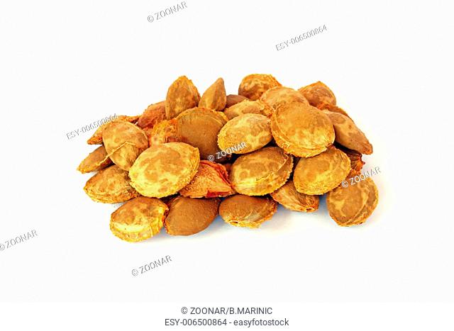 Apricot kernels, on white background