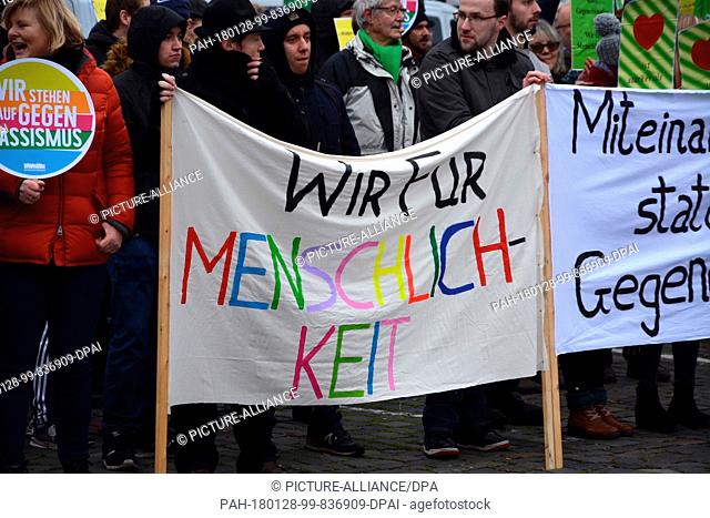 Supoporters of the group ""Aufstehen gegen Rassismus"" (lit. stand up against racism) protesting during a demonstration by the ""Frauenbuendnis Kandel"" (lit