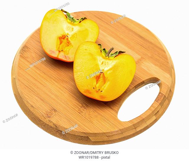 persimmon on a cutting board