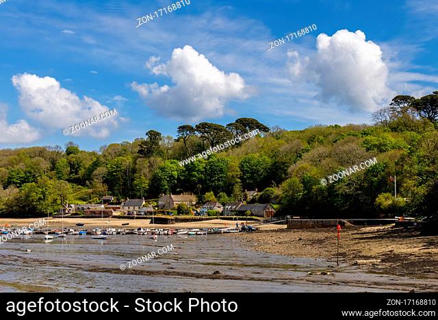 HELFORD, CORNWALL, UK - MAY 14 : View from Helford Creek at low tide in Helston, Cornwall on May 14, 2021. Two unidentified people