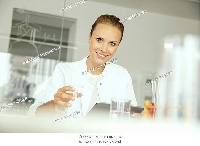 Portrait of smiling female scientist in lab