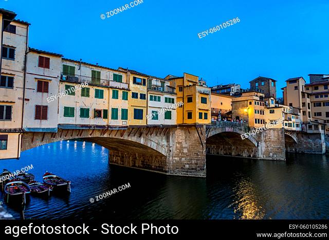 Florence, Italy - Circa June 2021: sunset on Ponte Vecchio - Old Bridge. Amazing blue light before the evening