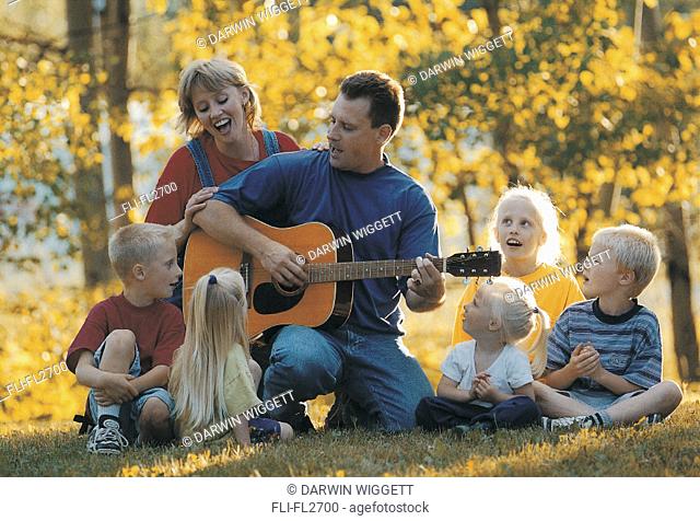 Family singing in the park