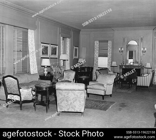 The living room of the suit at present occupied by General MacArthur at the Waldorf. The General does little entertaining