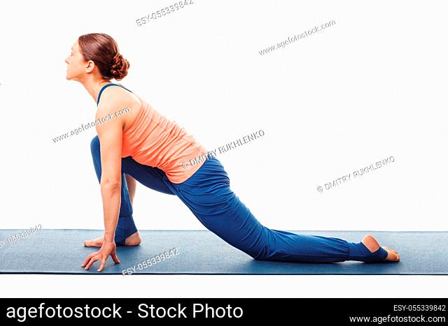 Woman doing yoga asana Anjaneyasana - low crescent lunge pose in Surya Namaskar Sun Salutation isolated on white background