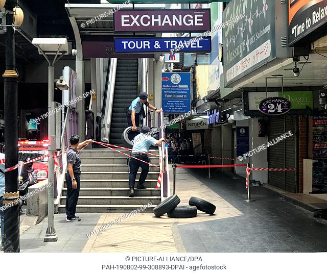 02 August 2019, Thailand, Bangkok: Thai police block the busy Skytrain station Salah Daeng after explosions of several explosive devices in the capital Bangkok