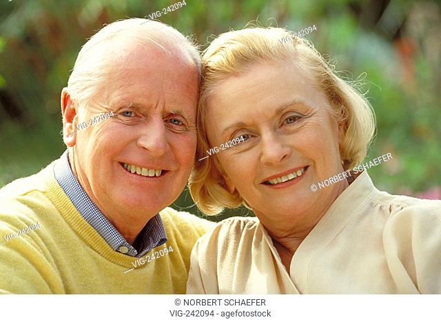 outdoor, portrait, senior-couple wearing bright dresses  - GERMANY, 12/09/2004