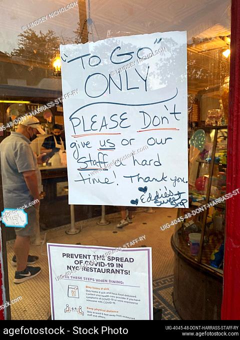 Please don't give our staff a hard time sign, Eddies Sweet Shop, Queens, New York