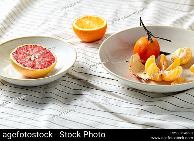 still life with mandarins and grapefruit on plate