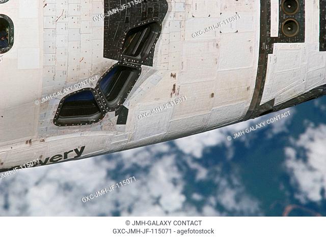 This close-up view of the starboard side of the crew cabin of space shuttle Discovery was provided by an Expedition 26 crew member during a survey of the...