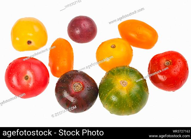 different tomatoes isolated on white background