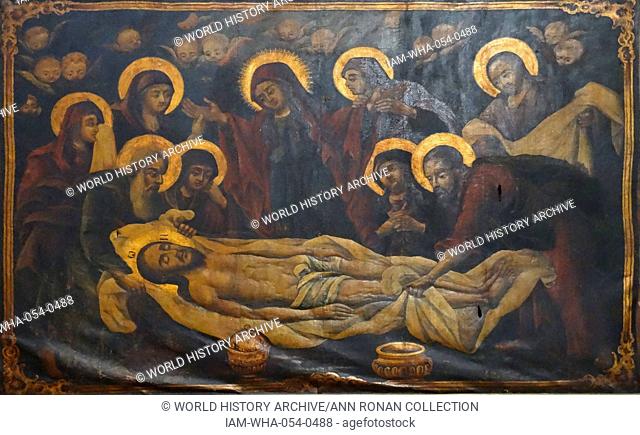 Greek icon of Christ being laid in the tomb in the Church of the Holy Sepulchre. The Church of the Holy Sepulchre in Jerusalem is identified as the place both...