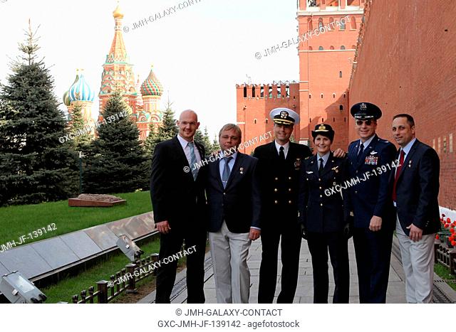 With St. Basil's Cathedral in Moscow's Red Square in the background, the Expedition 4041 prime and backup crew members pose for pictures at the Kremlin Wall May...