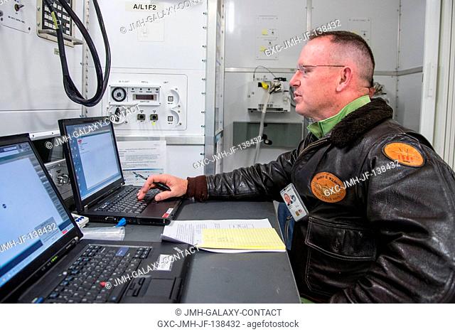 NASA astronaut Barry Wilmore, Expedition 41 flight engineer and Expedition 42 commander, participates in an electrical power system training session in the...