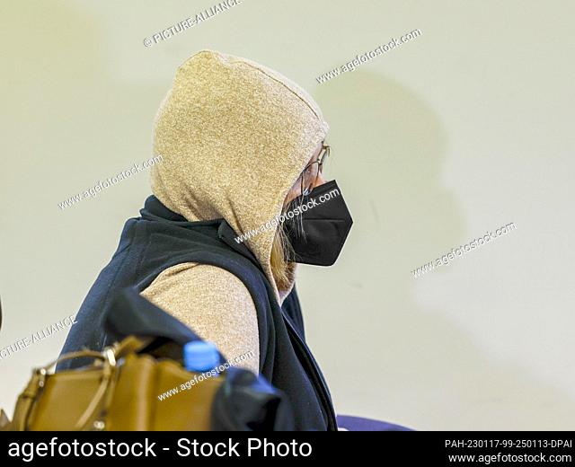 17 January 2023, Bavaria, Schweinfurt: The 51-year-old defendant sits in the courtroom wearing a mouth-nose protection. Her partner, a 54-year-old man