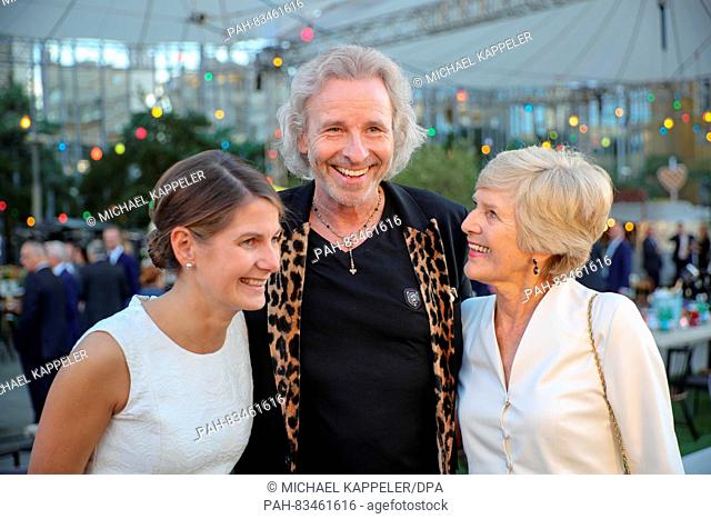 Entertainer Thomas Gottschalk standing together with 'Bild'-Editor in Chief Tanit Koch (l) and publisher Friede Springer at the 'BILD100' reception of Axel...