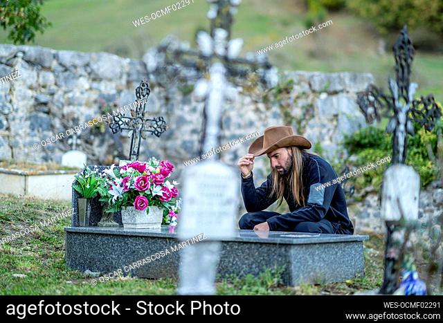 Man wearing hat at cemetery