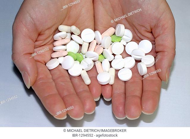 Tablets and pills on hands