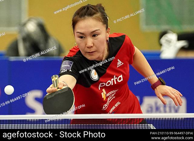 10 January 2021, Berlin: Xiano Shan of ttc berlin eastside hits the ball against V. Scholz of ESV Weil Tischtennis in the semi-finals of the German Women's...