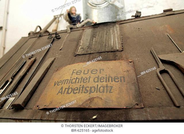 Warning sign on a forge at young German artists' studios, Dresden, Germany