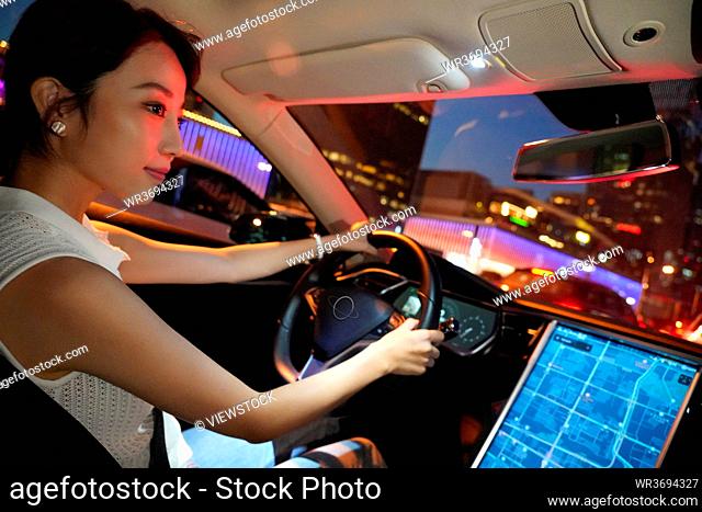 According to the map screen to drive at night young woman