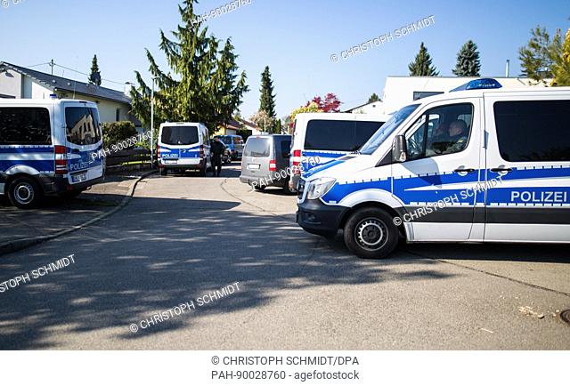 Police vehicles in a street in Rottenburg am Neckar, Germany, 21 April 2017. Police sealed an residential area off and searched a building after the arrest of a...