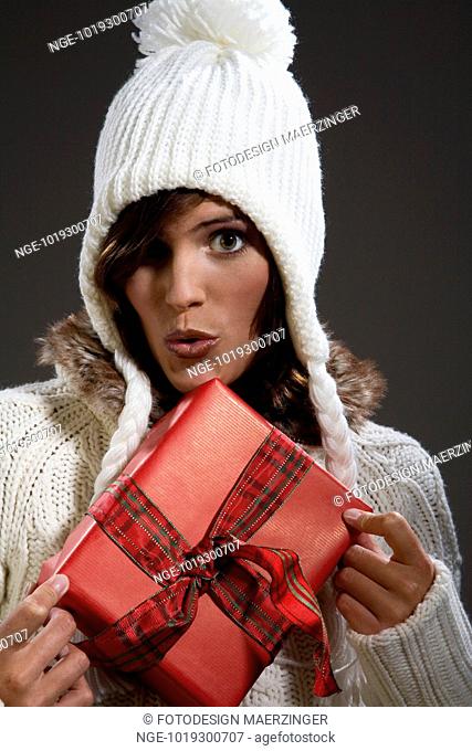 Woman in Winter Clothes with Present