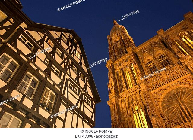 View to a timbered house and Our Lady's Cathedral, View to a timbered house and the west facade with spire of Our Lady's Cathedral Cathedrale Notre-Dame
