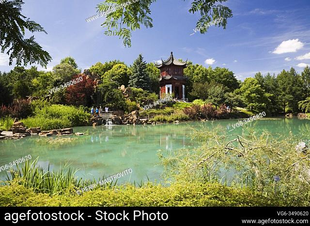 The Tower of Condensing Clouds pavilion and the Dream Lake in Chinese Garden in summer, Montreal Botanical Garden, Quebec, Canada