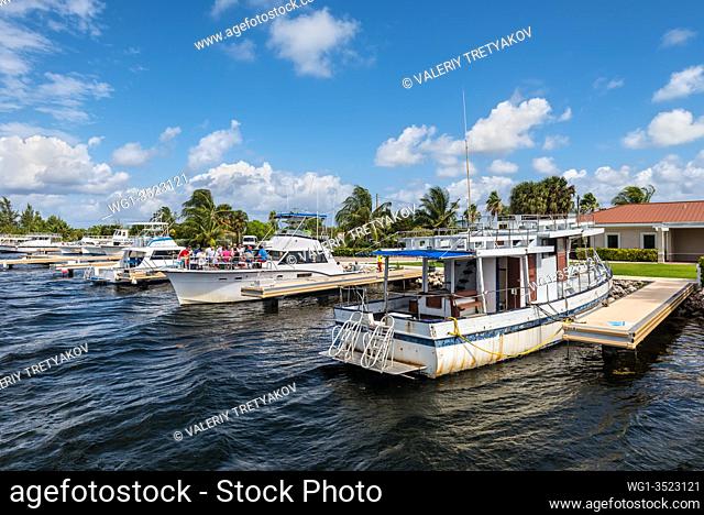 West Bay, Grand Cayman Island, UK - April 23, 2019: Boats moored at harbour near Stingray City in Grand Cayman, Cayman Islands, UK