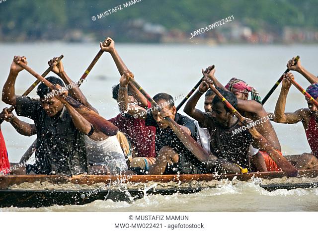Participants frantically rowing to win a traditional boat race or ‘Noukabaich’, on the Rupsha river in Khulna, sponsored by telecom company Bangla Link...