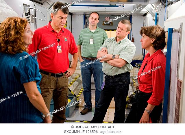Russian cosmonaut Dmitry Kondratyev (second right), Expedition 26 flight engineer and Expedition 27 commander; NASA astronaut Catherine Coleman (right) and...