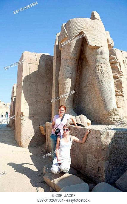 tourists against statues in Karnak temple