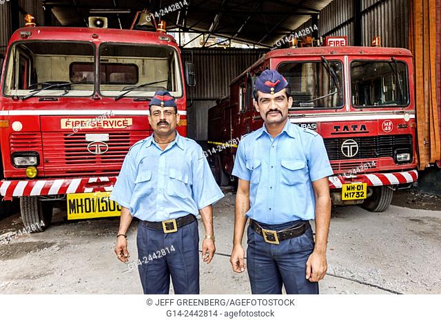 India, Asian, Mumbai, Dharavi, Shahu Nagar Road, slum, fire department, garage, fireman, firemen, uniform, man, coworker, Tata, vehicle, truck, service