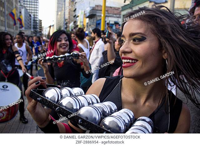 Woman member of a batucada group in the streets of Bogota