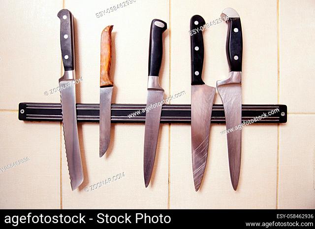 Picture of many knives represented on kitchen. Knives with steel blades for cooking or preparing any dishes or meals