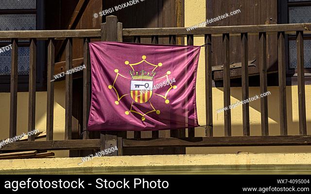 Flag of the Aran Valley, inspired by the Occitan flag, hanging from a balcony in the town of Les (Aran Valley, Lleida, Catalonia, Spain, Pyrenees)