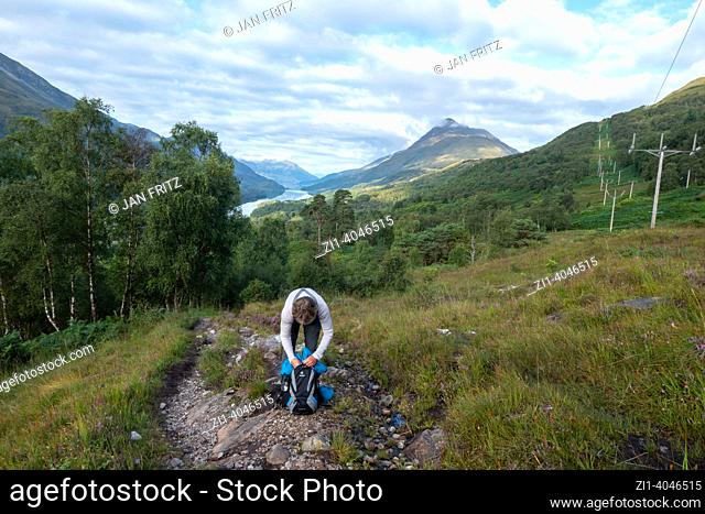 hiker in the highland mountains in the area of Kinlochleven in Scotland