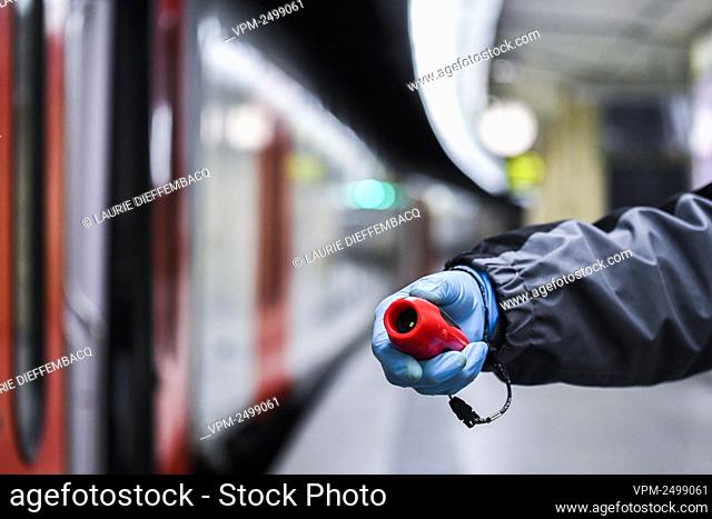 Illustration picture shows a SNCB NMBS worker with a new device to replace the whistle at SNCB NMBS Gare Centrale Bruxelles / Brussel Centraal Station