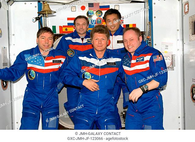 Crewmembers aboard the International Space Station pose for a group portrait during the ceremony of Changing-of-Command from Expedition 18 to Expedition 19 in...