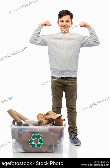 smiling boy sorting paper waste