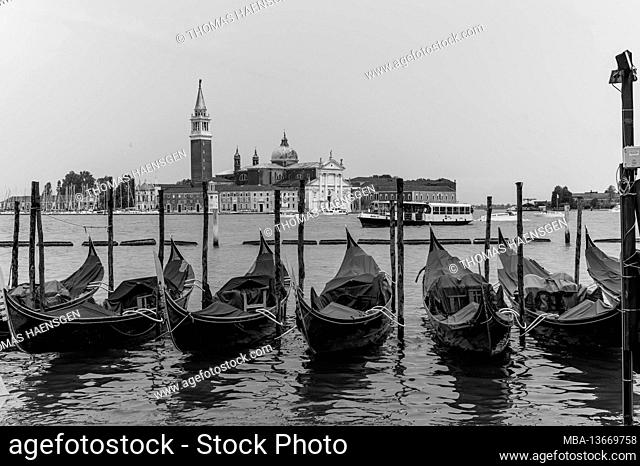 Monochrom shot of traditional Gondolas on Canal Grande with San Giorgio Maggiore church in the background, San Marco, Venice, Italy