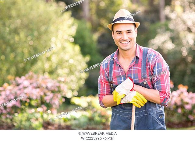 Gardener man posing with his rake