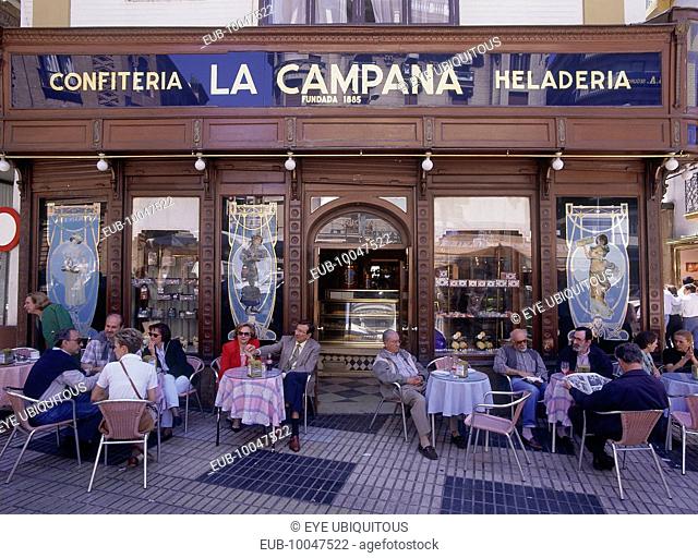 Santa Cruz District, La Campana the most famous Pasteleria cake shop with people sitting at tables on the pavement
