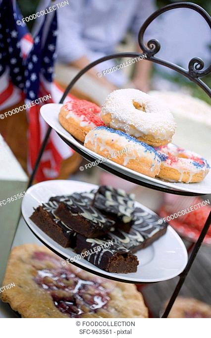 Doughnuts, brownies & pie on tiered stand 4th of July, USA
