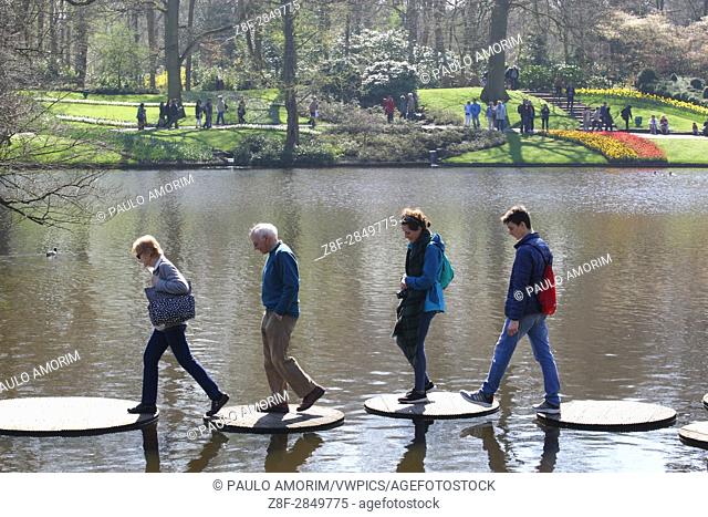 Daily Life - People enjoying at Keukenhof Park on April in Lisse, Netherlands. Keukenhof known as the Garden of Europe, a spring park with approximately seven...