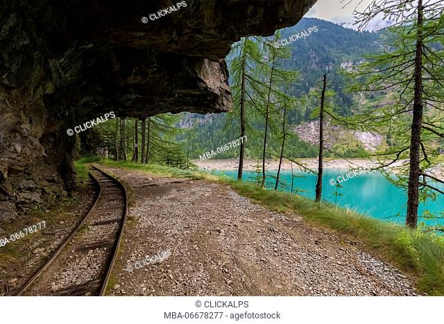 Trail with rails around Lago Campliccioli, Valle Antrona, Piedmont, Italy